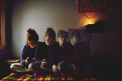 Multiple woman watching cellphone