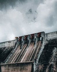 Low angle view of dam against sky