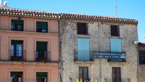 Low angle view of building against blue sky