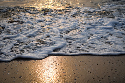 High angle view of surf on beach