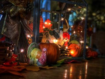 Close-up of illuminated christmas decorations at night