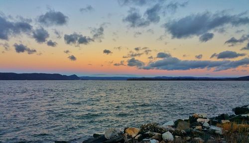 Scenic view of sea against sky at sunset