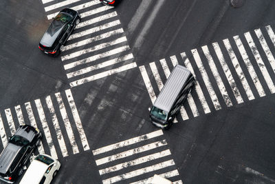 High angle view of cars crossing on road