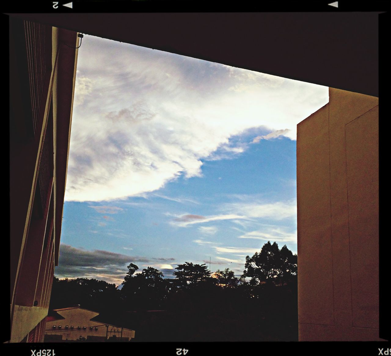 transfer print, sky, built structure, cloud - sky, auto post production filter, architecture, tree, silhouette, cloud, building exterior, house, cloudy, nature, window, low angle view, tranquility, sunlight, indoors, no people, beauty in nature