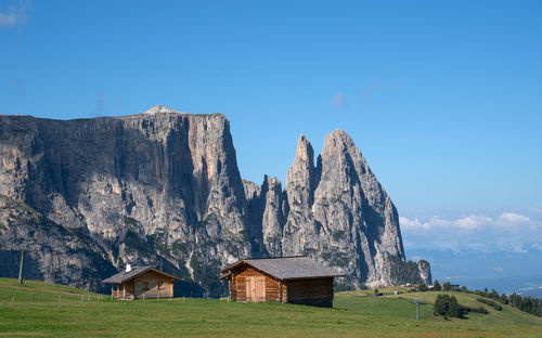 Scenic view of mountains against clear blue sky