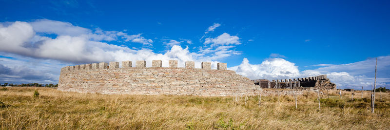 View of old ruins against blue sky