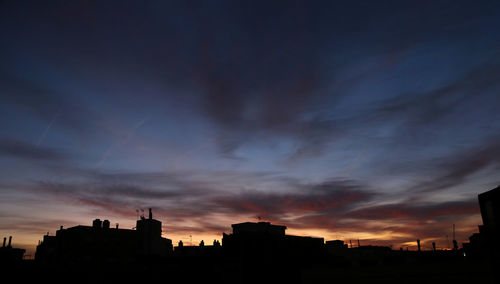 Silhouette of buildings at sunset