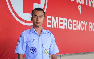 Portrait of young doctor standing banner