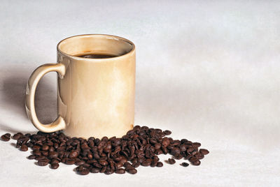 Close-up of coffee cup on table