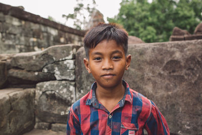 Portrait of boy against wall