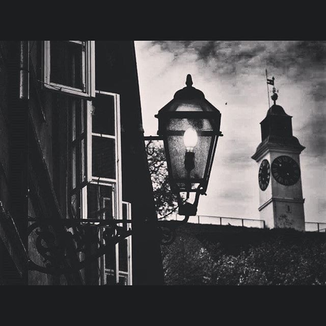 built structure, architecture, low angle view, building exterior, lighting equipment, street light, sky, sunlight, silhouette, no people, outdoors, day, house, lamp post, illuminated, electricity, safety, lantern, window, auto post production filter