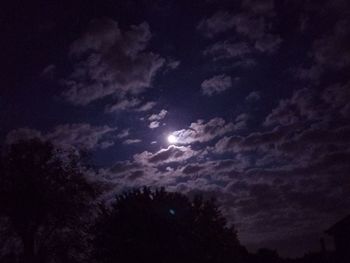 Low angle view of silhouette moon against sky at night