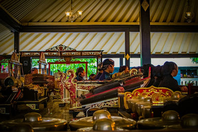 People at market stall