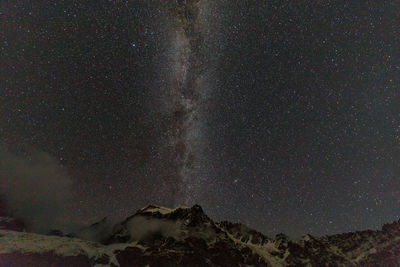 Low angle view of star field against sky at night