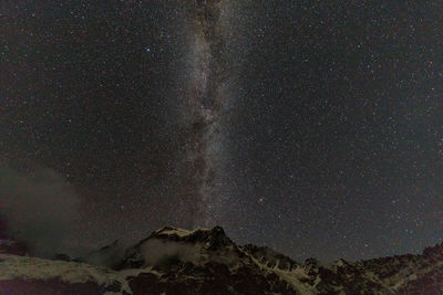 Low angle view of star field against sky at night