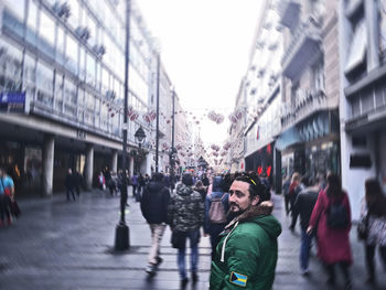 People walking on street in city