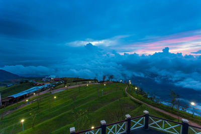 Aerial view of illuminated city against sky
