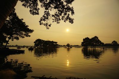 Scenic view of lake against sky during sunset