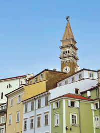 Low angle view of building against clear blue sky