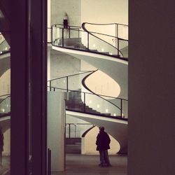 Full length of woman standing on railing