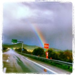 Rainbow over road