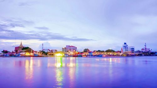 Illuminated buildings at waterfront