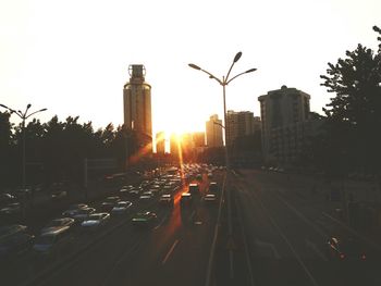 View of city street at sunset