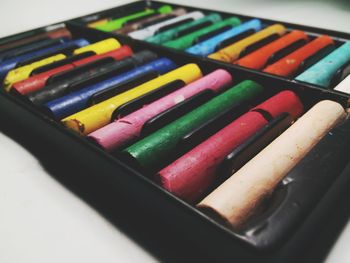 Close-up of colorful crayons in box