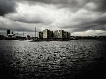 City skyline against cloudy sky