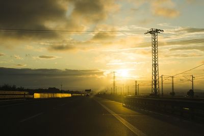 Road against cloudy sky during sunset