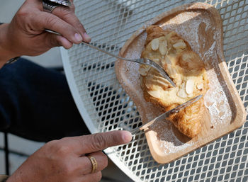 Cropped hand of man preparing food