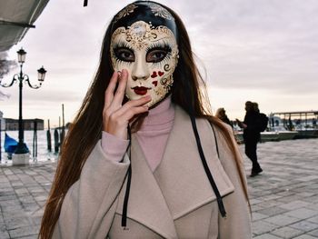 Portrait of beautiful woman wearing mask