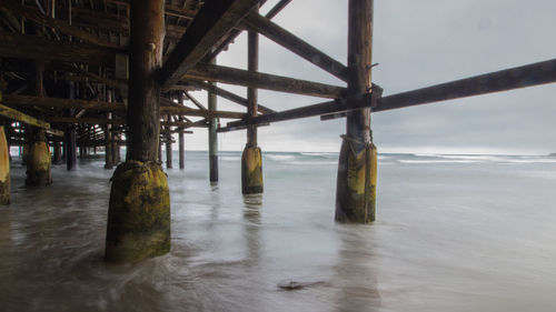 Pier on sea against sky