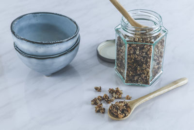 High angle view of coffee beans in glass jar on table