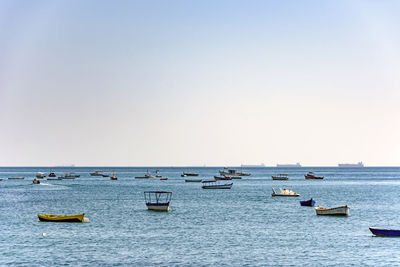 Evening at todos os santos bay in salvador bahia during a sunny summer day with its moored boats