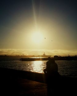 Silhouette of people at sunset