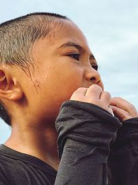 Close-up portrait of boy looking away