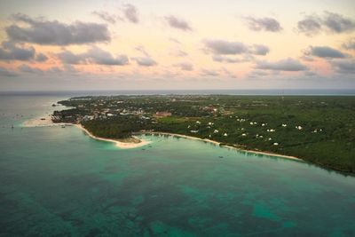 Scenic view of sea against sky in city