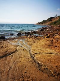 Scenic view of beach against sky