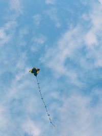 Low angle view of kite flying in sky