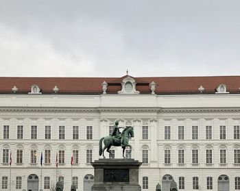 Low angle view of statue against building