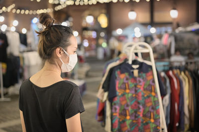 Series photo of young women shopping in night street market , chiang mai north of thailand