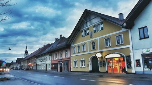 City street against cloudy sky