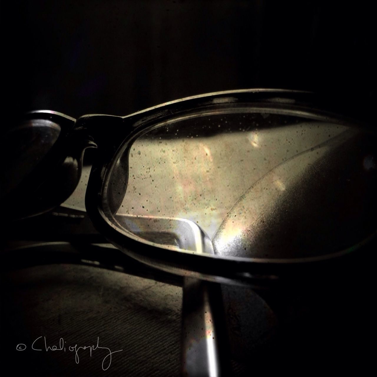 close-up, indoors, still life, glass - material, metal, no people, transparent, focus on foreground, table, single object, reflection, water, studio shot, drop, black background, food and drink, freshness, kitchen utensil, detail, glass