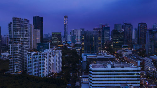 Modern buildings in city against sky