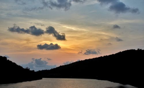 Scenic view of lake against sky during sunset