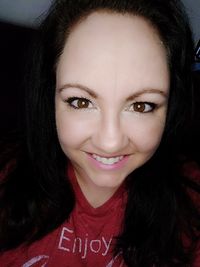 Close-up portrait of a smiling young woman