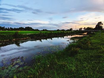 Scenic view of lake against sky during sunset