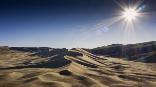 Scenic view of desert against sky