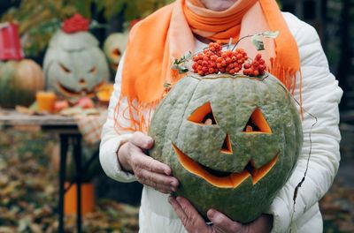 Midsection of woman wearing mask